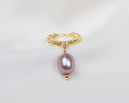 Handgemaakte 14k gold plated gedraaide oorbel met een paarse zoetwaterparel hanger