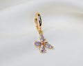 Handgemaakte 14k gold plated oorbel met vlinder hanger van lila zirkonia