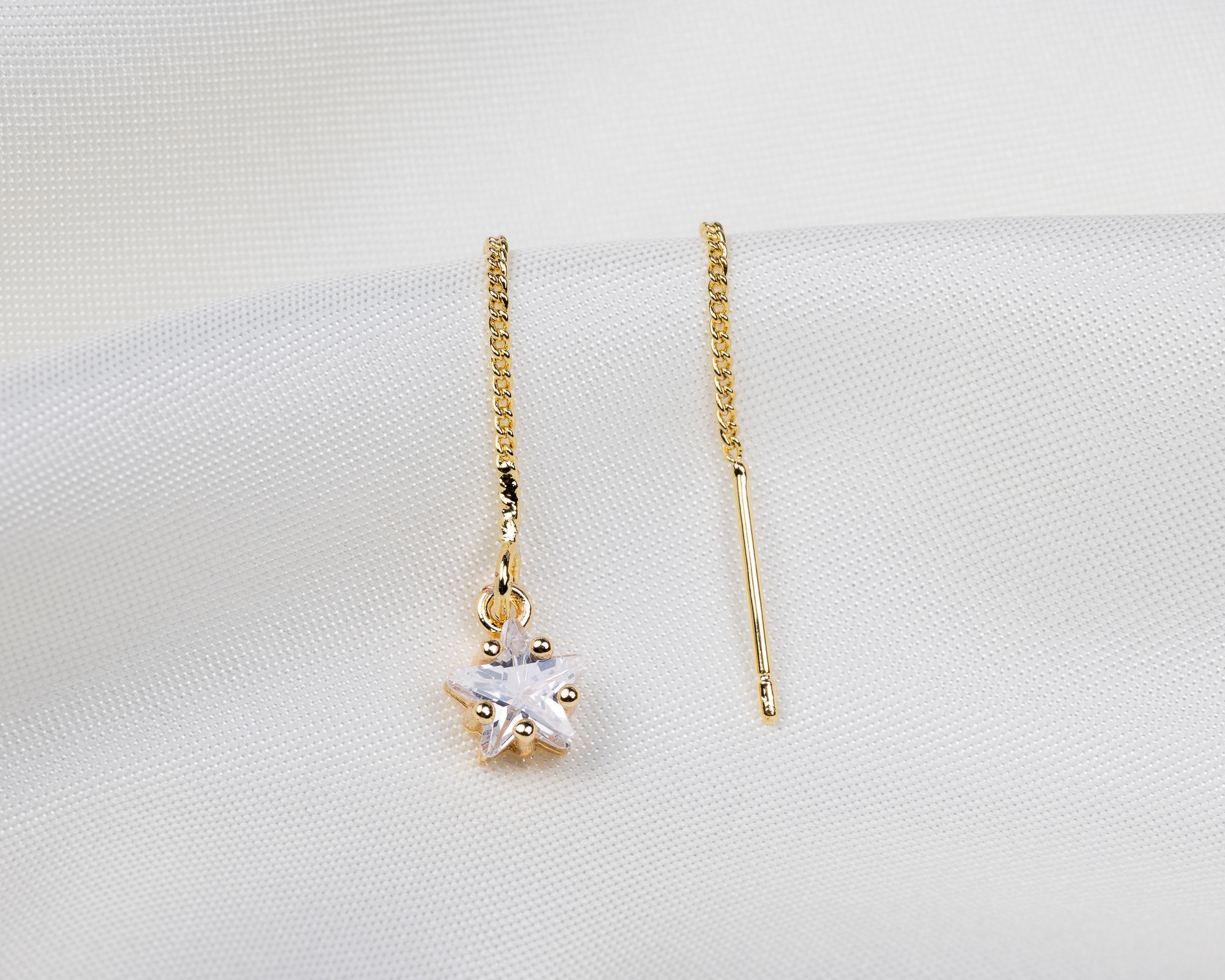 Handgemaakte 14k gold plated trekoorbel met geboortesteen van de maand april in de vorm van een ster