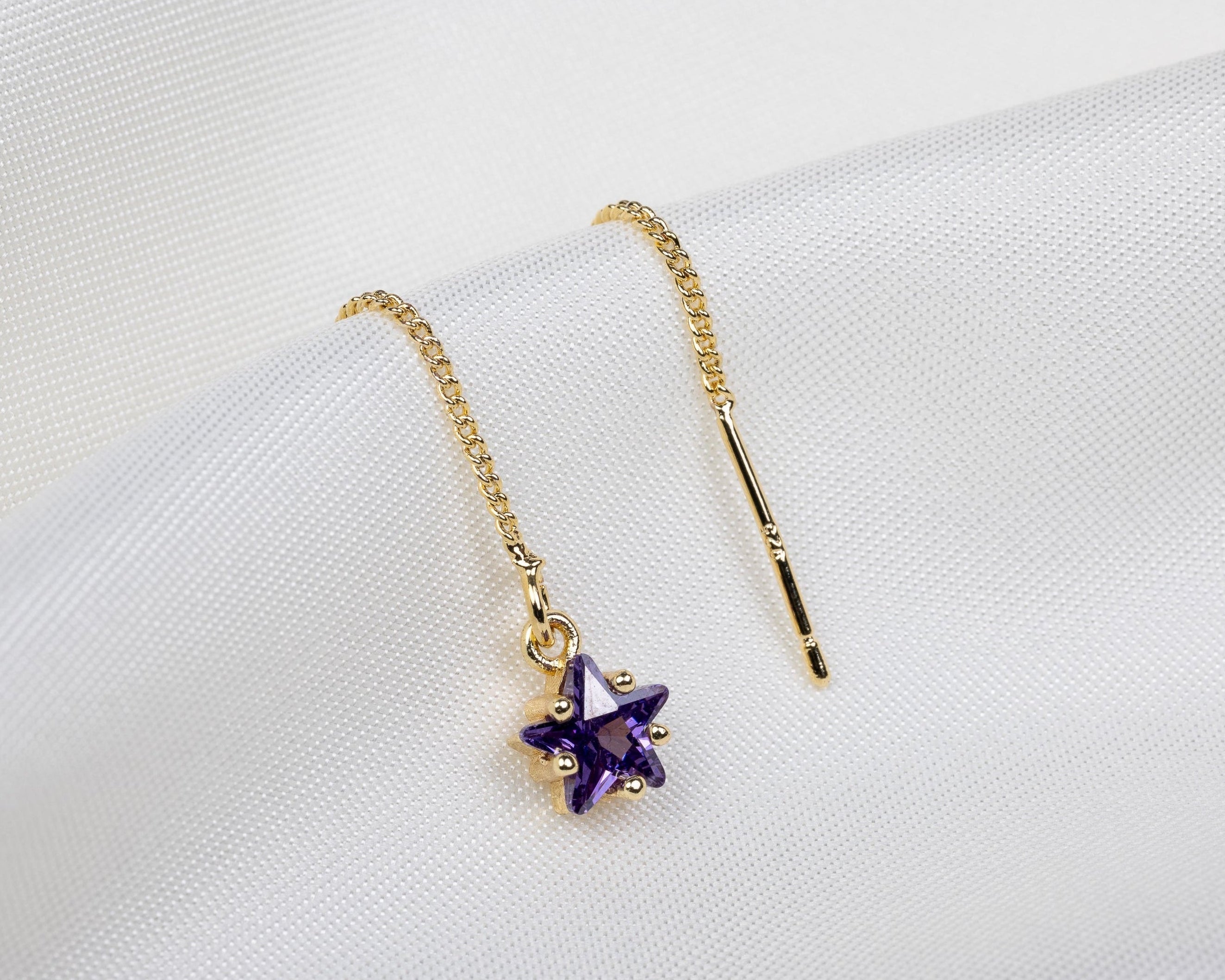 Handgemaakte 14k gold plated trekoorbel met geboortesteen van de maand februari in de vorm van een ster