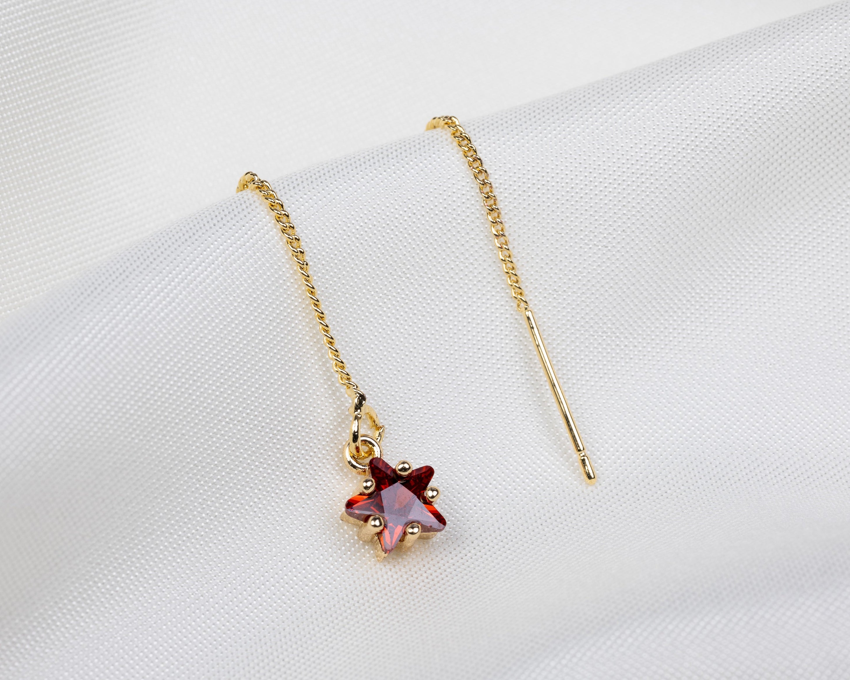 Handgemaakte 14k gold plated trekoorbel met geboortesteen van de maand januari in de vorm van een ster