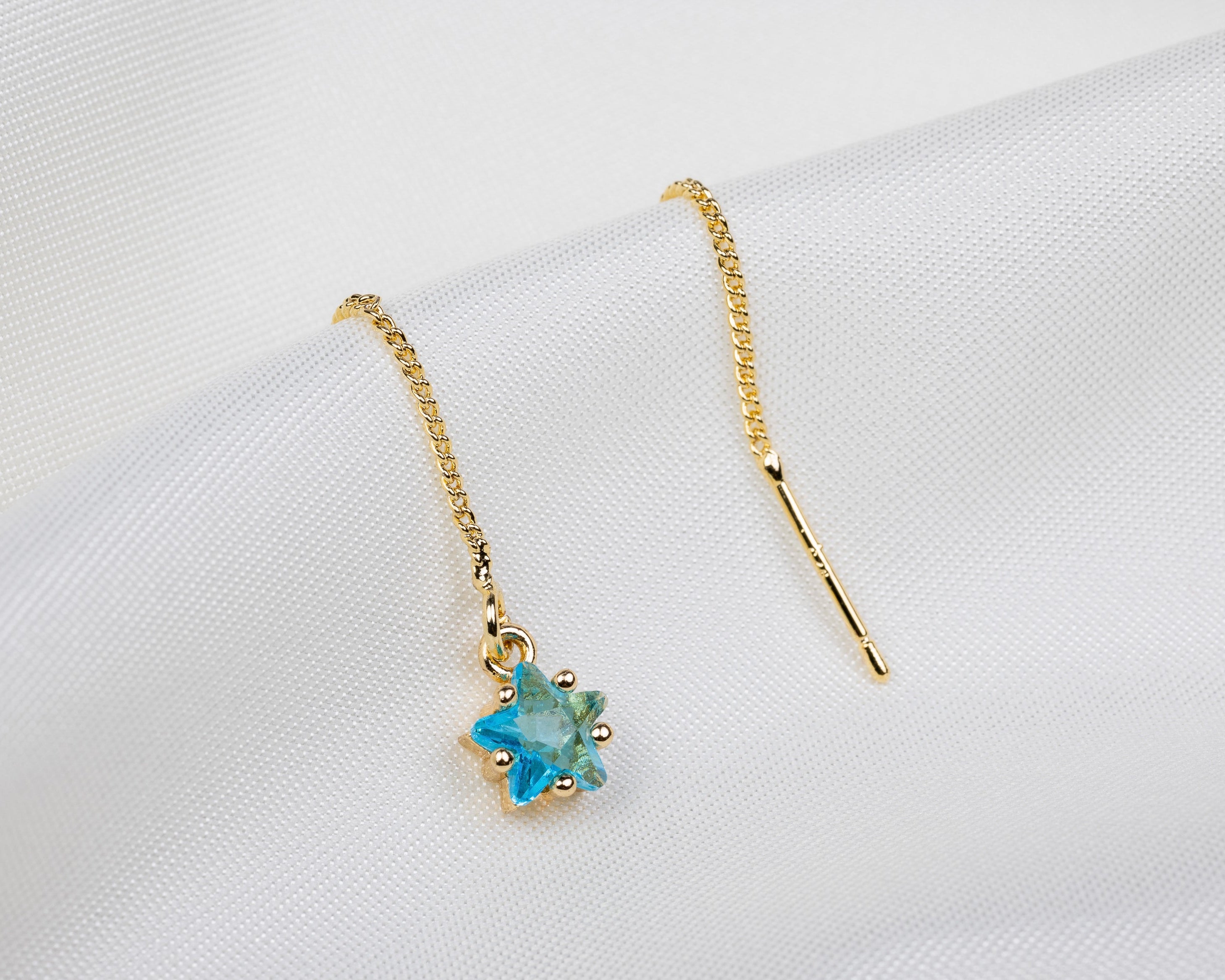 Handgemaakte 14k gold plated trekoorbel met geboortesteen van de maand maart in de vorm van een ster